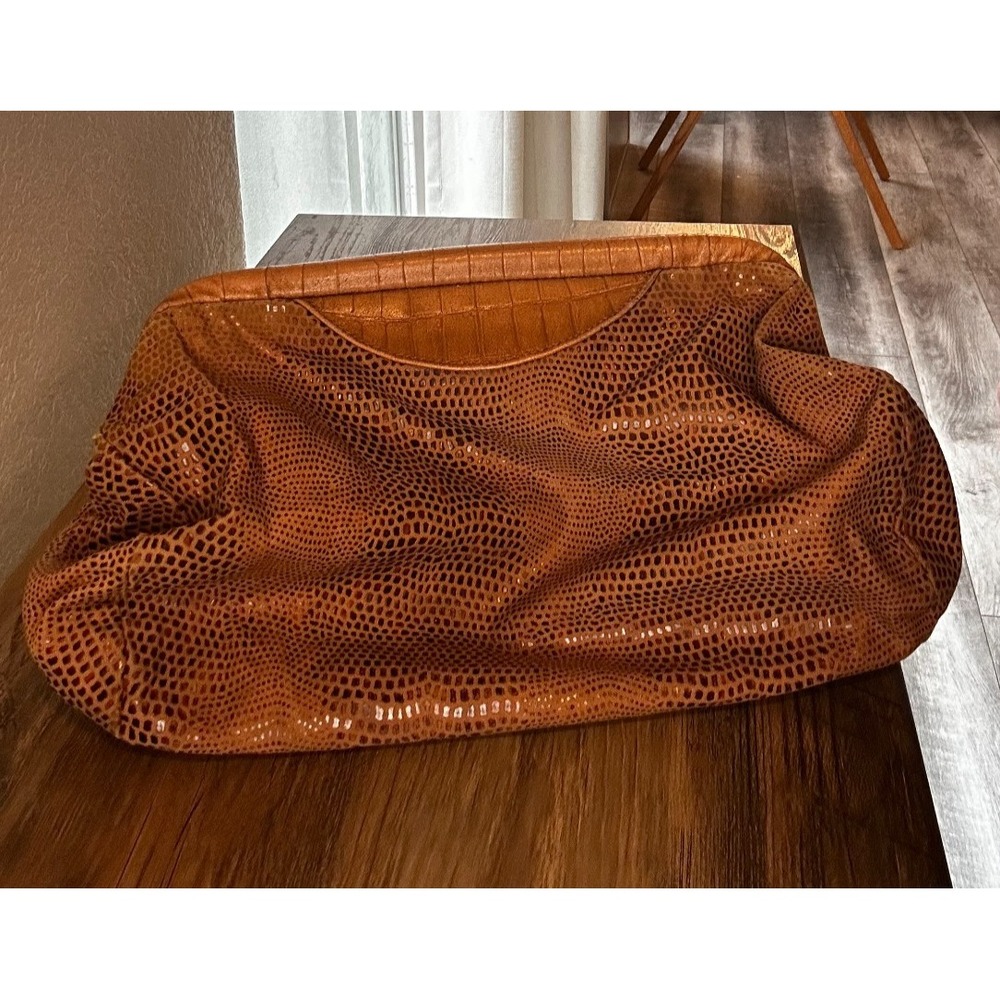 Faux leather slouchy brown clutch handbag with structured frame opening